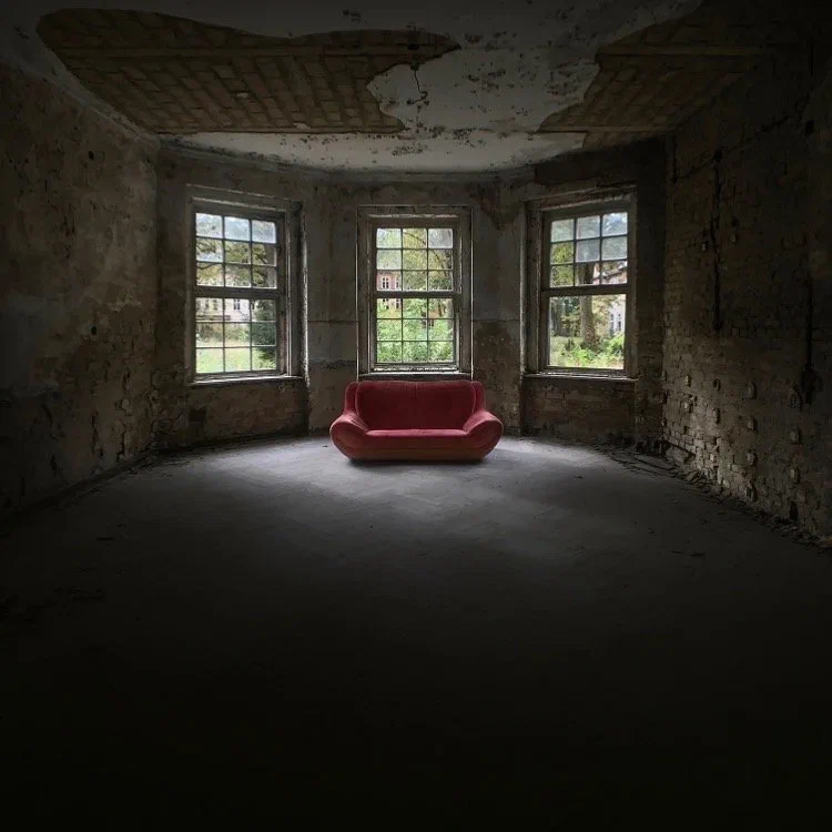 The red sofa at the abandoned Heilstätten in Grabowsee, Germany