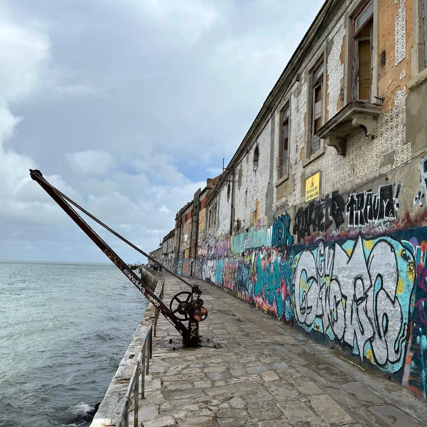 Abandoned buildings with tiles along the riverbank in Almada.